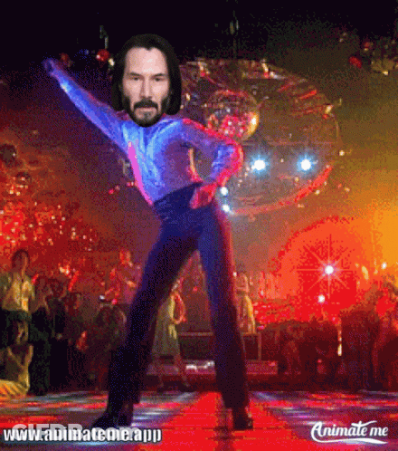 A Picture Of Keanu Reeves Dancing With A Disco Ball Behind Him GIF