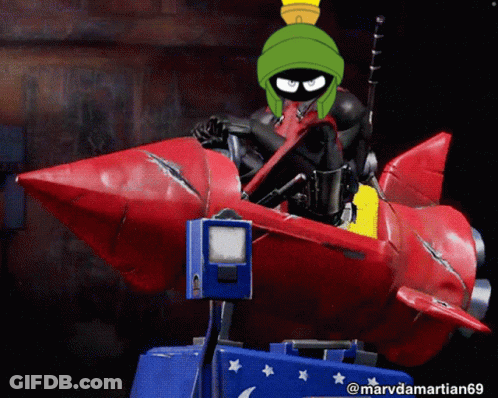 A Picture Of Marvin The Martian Riding A Rocket GIF