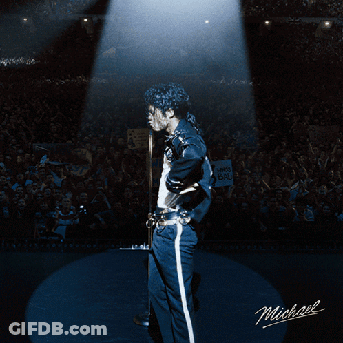 A Picture Of Michael Jackson On Stage With Smoke Behind Him GIF