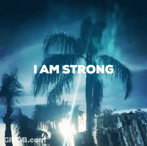 A Picture Of Palm Trees With The Words " I Am Strong " Above Them GIF