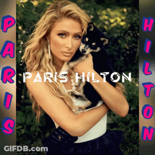 A Picture Of Paris Hilton Holding A Puppy GIF