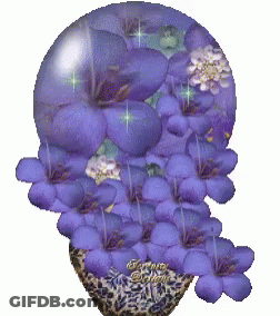 A Picture Of Purple Flowers In A Glass Sphere With A Watermark That Says Fantasy GIF