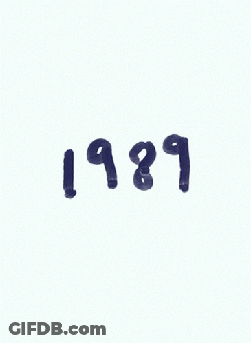 A Picture Of Taylor Swift With The Year 1989 GIF