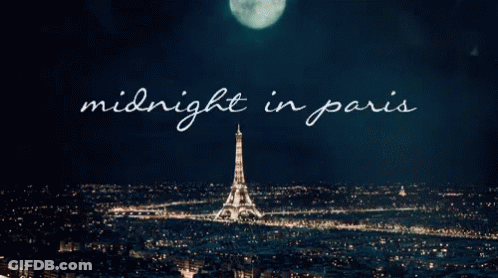 A Picture Of The Eiffel Tower At Night With The Words Midnight In Paris Above It GIF