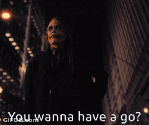 A Picture Of The Joker With The Words " You Wanna Have A Go " Below Him GIF
