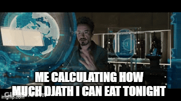 A Picture Of Tony Stark From Iron Man Calculating How Much Djath I Can Eat Tonight . GIF