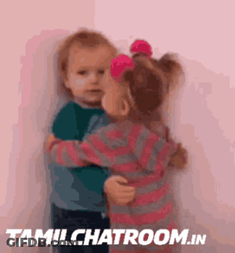 A Picture Of Two Children Hugging With Tamilchatroom.in In The Bottom Right Corner GIF