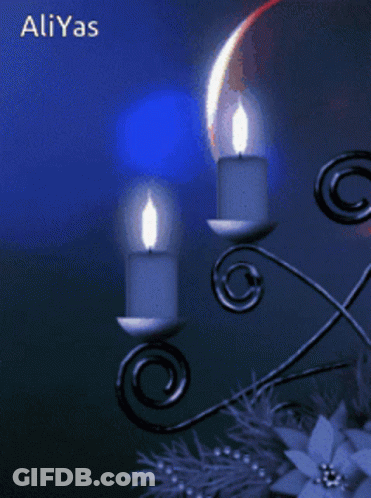 A Picture Of Two Lit Candles With The Name Aliyas On The Bottom Right GIF