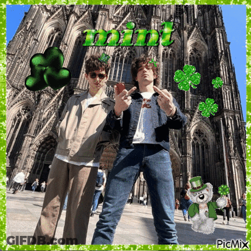 A Picture Of Two Men In Front Of A Cathedral With The Word Mint Written Above Them GIF