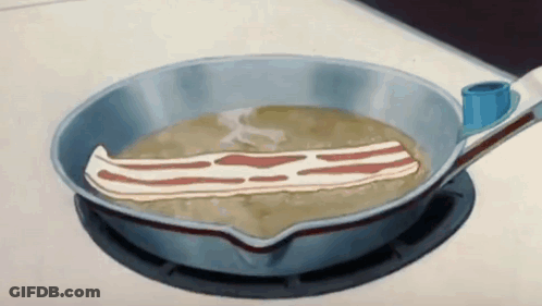 A Piece Of Bacon Is Being Cooked In A Pan GIF
