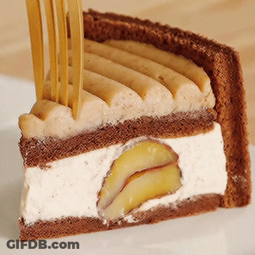 A Piece Of Cake With A Fork Sticking Out Of It On A White Plate GIF