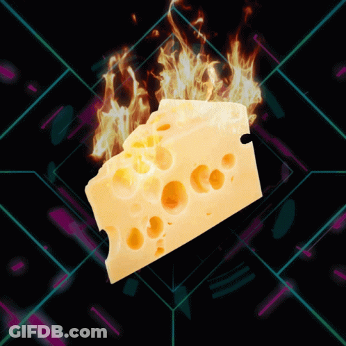 A Piece Of Cheese With Flames Coming Out Of It On A Dark Background GIF