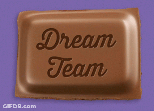 A Piece Of Chocolate With The Words Dream Team Written On It GIF