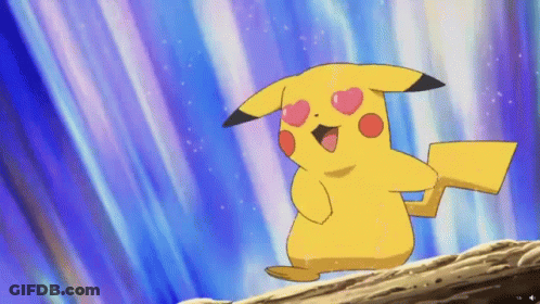 A Pikachu With Hearts On Its Eyes Stands On A Rock GIF