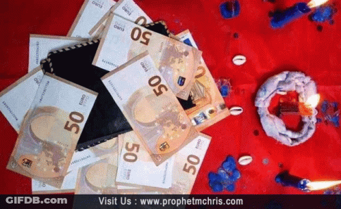 A Pile Of 50 Euro Bills Laying On A Red Cloth GIF