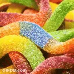 A Pile Of Colorful Gummy Worms With A Blue Stripe On The Bottom GIF