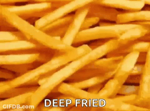 A Pile Of Deep Fried French Fries With The Words `` Deep Fried '' Written On It . GIF