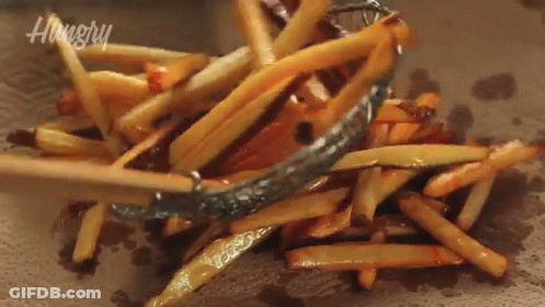 A Pile Of French Fries Are Being Scooped Out Of A Bowl With A Hungry Logo In The Background GIF