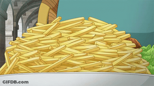 A Pile Of French Fries On A Plate With A Castle In The Background GIF