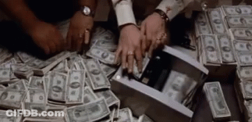 A Pile Of Money Is Being Taken Out Of A Box By Two People . GIF