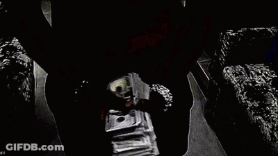 A Pile Of Money Is Sitting On Top Of A Table . GIF