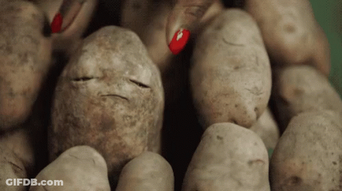 A Pile Of Potatoes With A Face Drawn On One Of Them GIF