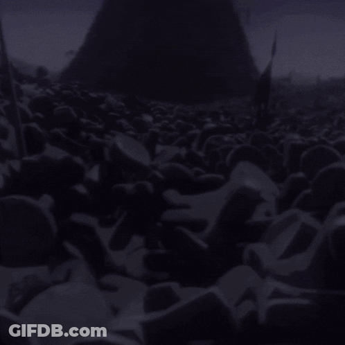 A Pile Of Purple Rocks In Front Of A Purple Pyramid GIF