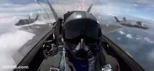A Pilot Is Flying A Fighter Jet In The Sky With Other Fighter Jets . GIF