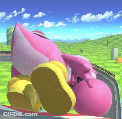 A Pink And White Cartoon Character Is Laying On The Ground GIF