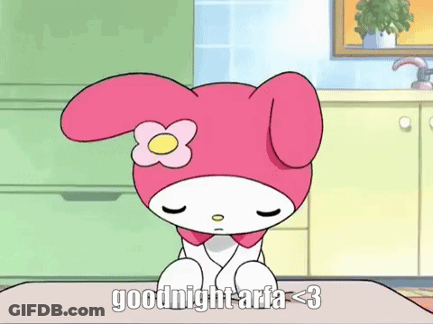 A Pink And White Cartoon Character With A Flower On Her Head Is Sitting On A Table And Says Goodnight Aria < 3 . GIF