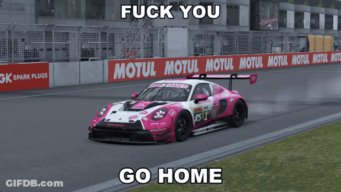 A Pink And White Race Car On A Track With A Motul Sign In The Background GIF