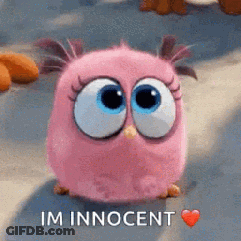 A Pink Angry Bird From The Angry Birds Movie Is Sitting On The Ground With A Heart . GIF