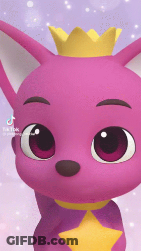A Pink Baby Shark With A Yellow Crown On His Head GIF