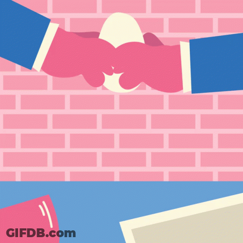 A Pink Brick Wall Is Behind Two Hands Shaking Hands GIF