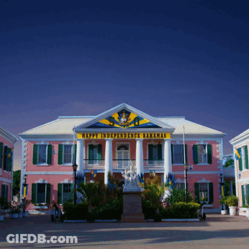 A Pink Building With The Words Happy Independence Bahamas On The Top GIF