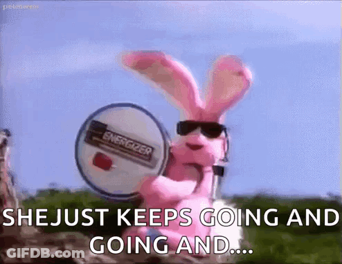 A Pink Bunny Rabbit Wearing Sunglasses Is Holding A Drum . GIF