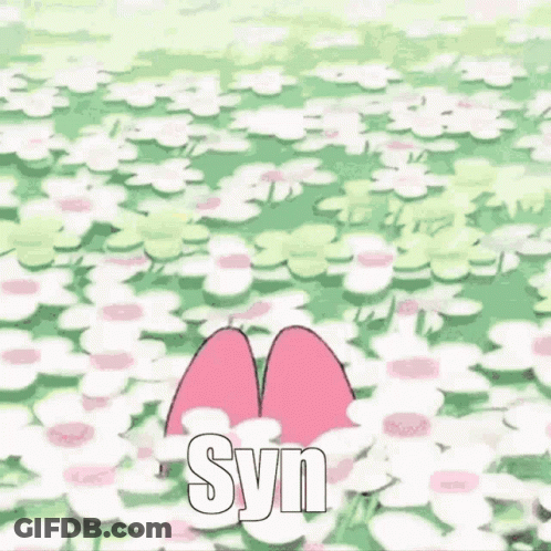 A Pink Bunny With A Flower In Its Hair Is Standing In A Field Of White Flowers . GIF