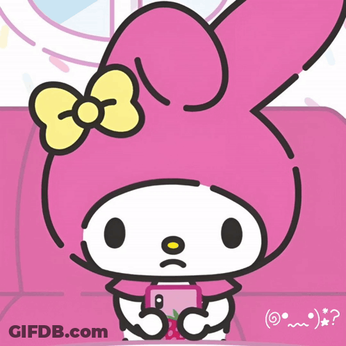 A Pink Bunny With A Yellow Bow Is Sitting On A Couch GIF