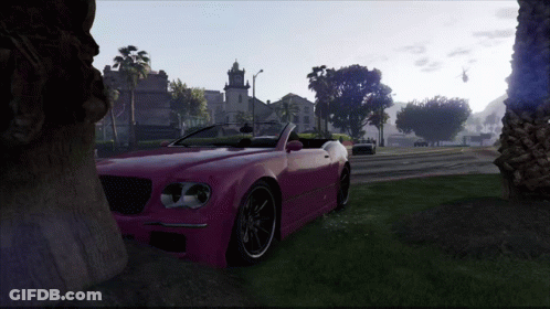 A Pink Car Is Parked In A Grassy Field GIF