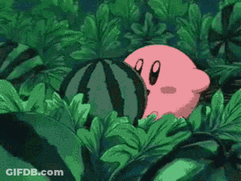 A Pink Cartoon Character Is Sitting In The Leaves Of A Plant . GIF