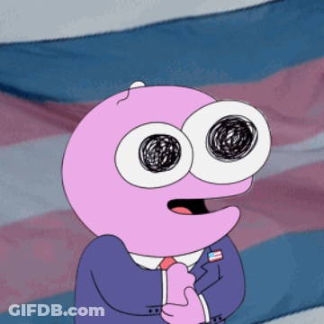 A Pink Cartoon Character With Big Eyes Is Standing In Front Of A Flag GIF