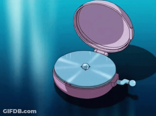 A Pink Clock With A Blue Disc Inside Of It GIF