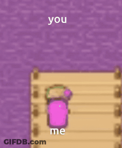A Pink Cube Is Sitting On A Wooden Dock Next To A Purple Wall And Says You Me GIF