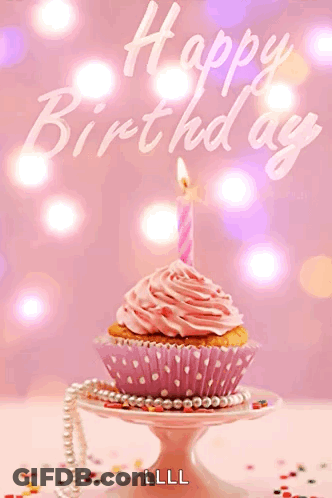 A Pink Cupcake With A Candle And The Words Happy Birthday Written On The Bottom GIF