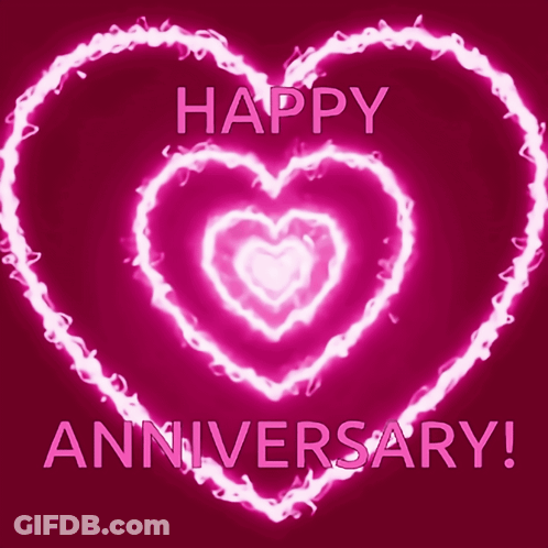 A Pink Glowing Heart With The Words Happy Anniversary Written Below It GIF