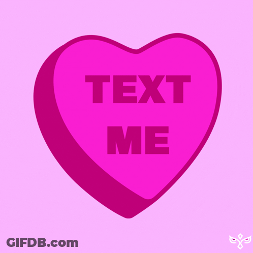 A Pink Heart Shaped Candy Says Text Me GIF