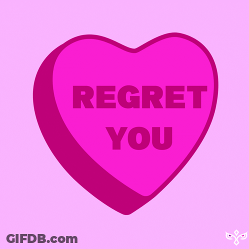 A Pink Heart Shaped Candy That Says Regret You GIF