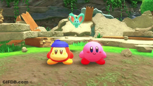 A Pink Kirby And A Blue Kirby Are Standing Next To Each Other GIF