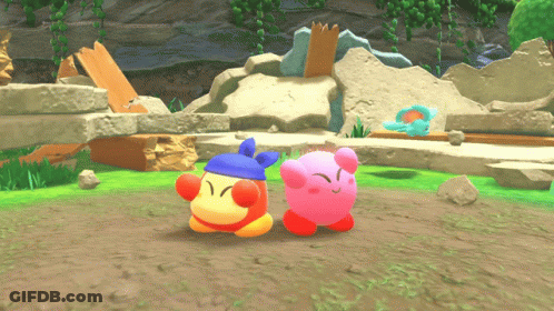 A Pink Kirby And A Red Kirby Are In A Video Game GIF