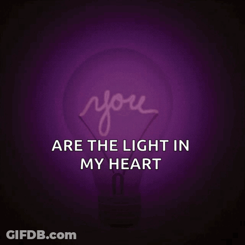 A Pink Light Bulb With The Words You Are The Light In My Heart GIF